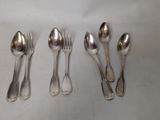 five spoons and two spoons on a table