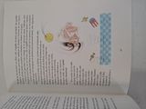 an open book with a picture of a cat and a dog on it
