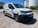a white van that is parked on the side of the road