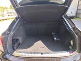 a trunk of a car with the back door open