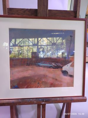 a picture of a painting on a easel in a room