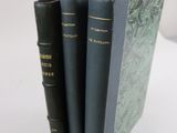 three books that are stacked on top of each other