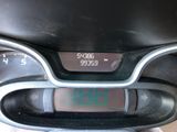 a close up of a digital clock on the dashboard of a motorcycle