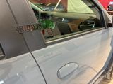 a close up of a car door handle with a sticker on it