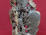 a statue of a vase with a bird on it