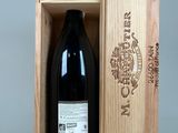 bottle of wine in a wooden box with a ribbon around it