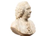 marble bust of a man with curly hair on a white background