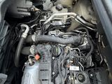 a picture of a car engine with its hood open