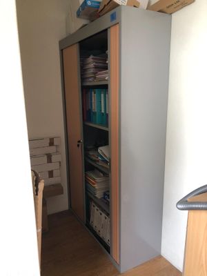 a book shelf that has a bunch of books on it