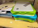 a stack of plastic trays sitting on top of a table