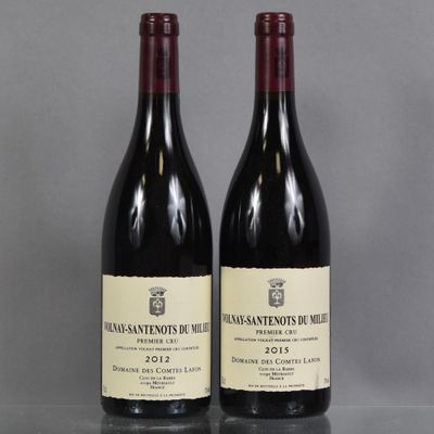 two bottles of wine sitting on top of a table next to each other