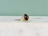 an image of a ring with a garnetite stone