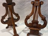 two wooden candlesticks that are sitting on a table