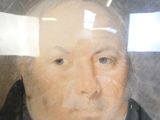 un tableau représentant un homme en costume-cravate