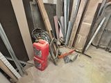 a red fire hydrant in the middle of a pile of construction materials