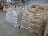 many bags of plastic sitting on a pallet in a warehouse