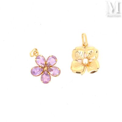 two gold - plated charms with a flower and a butterfly