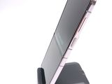 a cell phone that is sitting on top of a stand