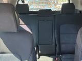 a man sitting in the back seat of a car