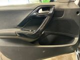 the interior of a car with the door open and the door handle open