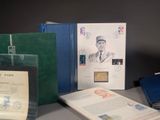 many books on a table with a drawing of a man on it