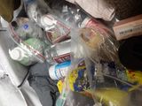 a pile of clothes and other items on the floor