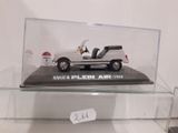a display case with a model of a car in it