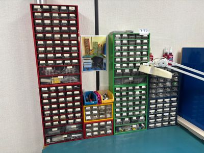 many bins of assorted items in a room