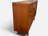 an image of a wooden cabinet on wheels