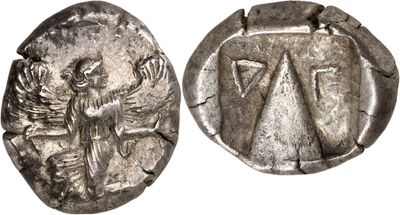 a silver coin with an image of a woman on it