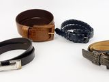 three belts and a belt with a buckle on a white background