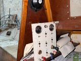 a bed with a wooden headboard and a radio on top of it