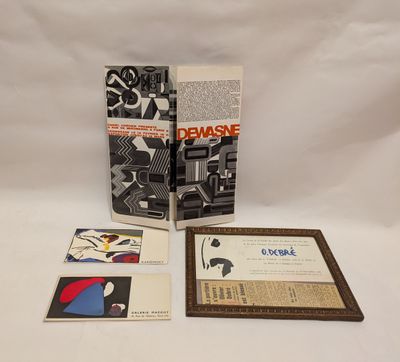 a couple of books sitting on top of a table next to each other