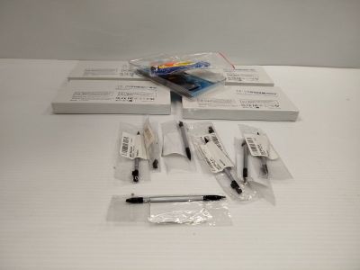 a lot of pens and a pen on the table