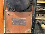 a green hose that is attached to a machine