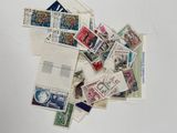 a pile of old postages on a white surface