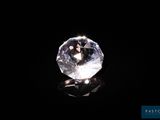 a close up of a diamond on a black surface
