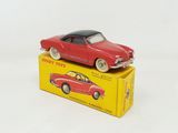 a red toy car sitting on top of a yellow box