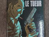 the cover of a book with a man holding a gun and smoking a cigarette