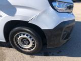 a close up of the front of a car with a flat tire