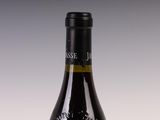 a bottle of wine that is sitting on a table