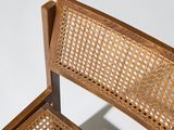 an image of a wooden chair with a woven seat and back