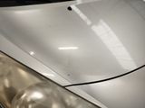 a close up of a car ' s headlight and the front of it