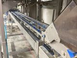 a picture of a conveyor belt in a factory
