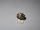 a ring that is sitting on top of a white surface
