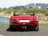 a red sports car parked on the side of the road