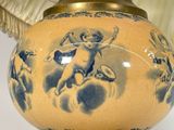 an image of a blue and white vase with cherensils on it