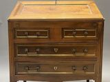 an antique wooden chest of drawers with brass handles and drawers