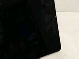 a black tablet that is sitting on a table