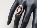 an image of a woman ' s hand with a ring on it ' s finger